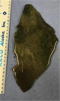 Large slab of green stone specimen embedded with c