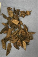Bag of fossilized ivory and fossilized bone pieces