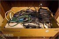 Box of assorted cables chargers & outlets