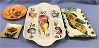 assorted trays decorated with fish, fruit and/or f