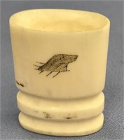 Ivory cup, 2" tall and scrimmed with a seal and se