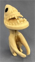 Ivory tupilak carved from whale's tooth: 4" tall