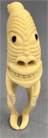 Ivory tupilak carved from whale's tooth: 4.5" tall