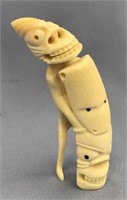 Ivory tupilak carved from whale's tooth: 5.5" tall