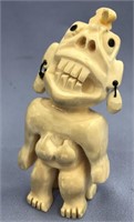 Ivory tupilak carved from whale's tooth: 2 faced,