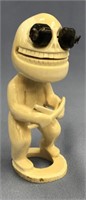 Ivory tupilak carved from whale's tooth: 4.5" tall