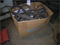 Box of assorted used and unused belts