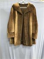 A woman's, thigh lenth ottter fur coat, iin great
