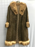 A woman's below the knee lenth beaver fur coat, wi