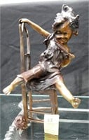 SIGNED BRONZE FIGURE OF GIRL & CATS ON CHAIR