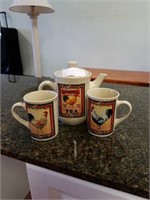 Tea pitcher and 2 mugs with rooster on them