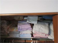 Two shelves of linens