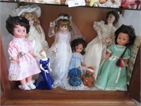 Shelf full of dolls