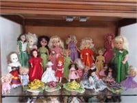 Shelf full of dolls
