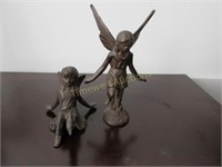 Two cast iron fairy figures