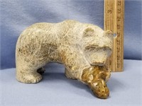 4" carved soapstone bear eating a fish, tail is br