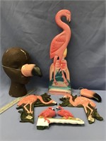 Large carved wood flamingo and several hang on the