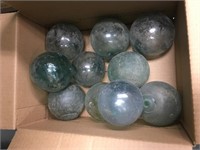 Box with  10 very old glass fish floats one has a