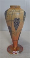 Beautiful glass vase. Measures 10" tall.