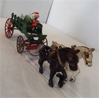 Vintage cast iron horse and Christmas wagon.
