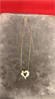 Gold chain with heart pendant