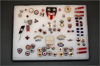74 Red Cross-related items: Pins, buttons, etc.