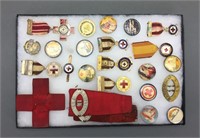 23 items: Buttons, medals, lapel pins, ribbons.