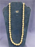 Beautiful set of ivory beads carved as flowers 32"