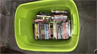 40+ DVDs in a tub with a lid, (793)