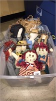 Tub with lid of Raggedy Ann dolls, Amish people