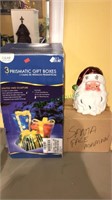 Three prismatic gift box with lights, Santa head