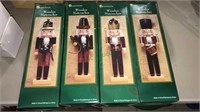 Four wooden nutcrackers in the boxes, all