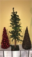 Three decorative Christmas trees including a