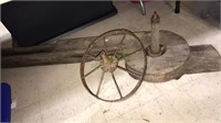 Antique water trough pump, iron spoke wheel, the