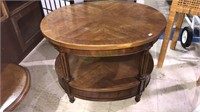 Mahogany oval side table, with a shelf below, 21