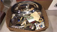Basket of silver plate items, military patches,