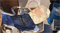 Large box of new handbags, beige and navy blue,