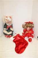 PAIR OF PRECIOUS MOMENTS DOLLS WITH STOCKINGS