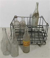 Metal bottle carrier with bottles