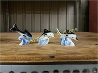 Set of three 2 inch porcelain dolphin figurines