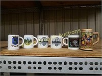 Six small collector mugs
