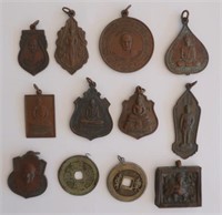 Ten antique Thai bronze amulets