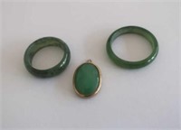 Two Jade rings and a small pendant (3)