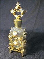 Perfume bottle in metal holder