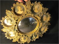 Mirror with lady portraits in frame