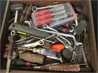 Wooden drawer full of tools.