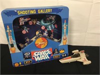Vintage arcade game and Star Wars toy.