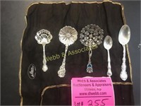 5 fancy spoons & 2 regular spoons