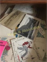 Boxes of cookbooks and vintage postcards