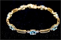 Gold Bracelet with Diamonds and Blue Stones